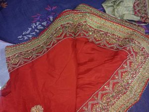 Red Heavy Saree With Golden Blouse.