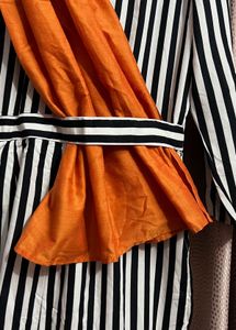 Bold Striped Jumpsuit with Statement Orange Detail