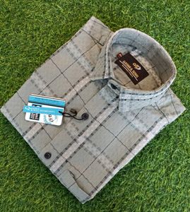 Elevate your style with this classic checked shirt
