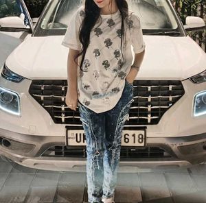 Ripped Blue Jeans With White Baggy Tshirt