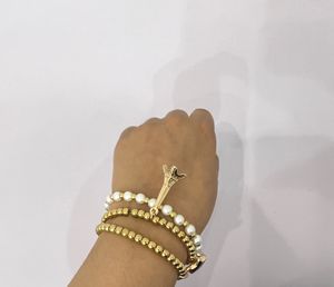 3 Beaded Pearl Bracelets With Charms