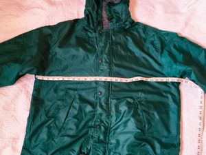 Green hooded windbreaker