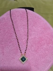 Ad Kundan Stone Mangalsutra In Dark Green Colour