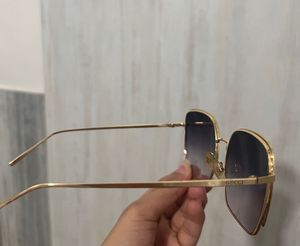 Black Sunglasses With Golden Frame