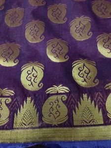 ElegantBrownFancy Pattu Sareewith blue border.