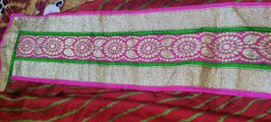 Bright red Gujarati leheriyu saree with pink and green border lace with blouse