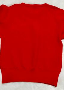red woolen top