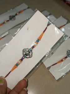 Silver Ganesha Rakhi Set Of 8
