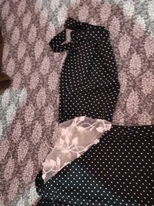 A Black Polyster Top With White Dots Nd Classic .