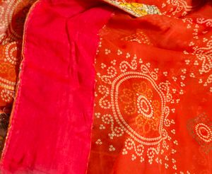 very pretty bandhani orange saree