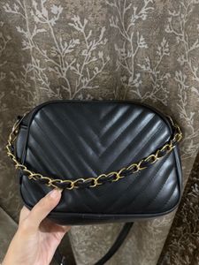 A black crossbody bag