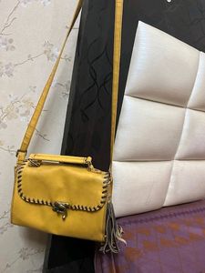 at half rate now mustard hand bag