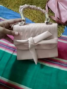 Elegant Pink Handbag with Bow Detail
