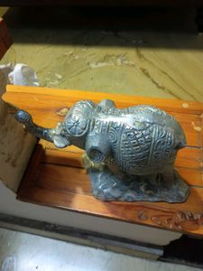white metal elephant figurine.
