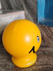 A Small Yellow Smiley Piggy Bank