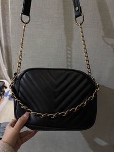 A black crossbody bag