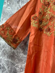 Elegant Orange Kurta Set with Embroidered Details