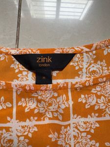 Zink Orange Floral Ruffle Top