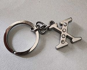 X Latter Keychain Stainless Still