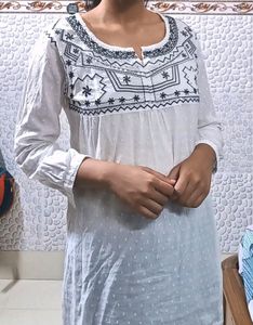 Pure Cotton, White Kurti From The Brand DJ& C.It Has Black Thread Work With Silver Sequins Work.