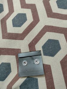 White Stud With Green And Golden Border
