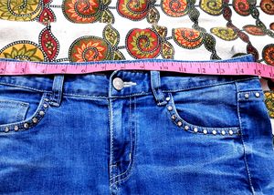 Girls ripped embroided jeans like new.