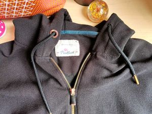 Black sweater with gold zip