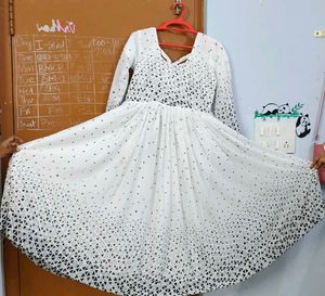 White frock with black dots design..