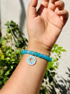 Light Blue Glass Beads Bracelet With Hanging Charm.