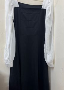 Chic black dress with white sleeves