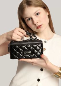 Mini Westt Quilted Clutch