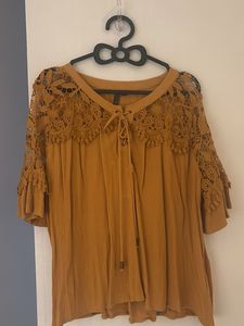 Mustard Top With Netted Hand Design Looks Classy