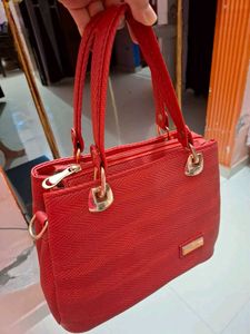 Stylish textured red handbag for women