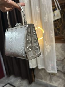silver fancy hand bag all metal