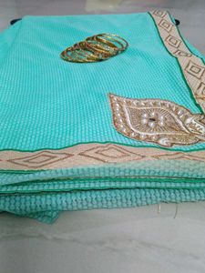 Elegant Teal Saree with Gold Embroidery