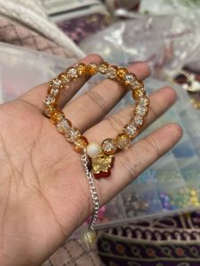 orange Beaded Bracelet with Charm