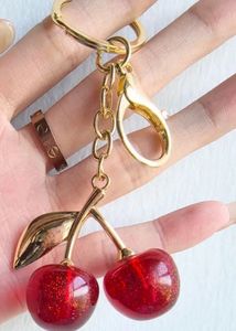 COACH DUPE RED CHERRY CHARM KEYCHAIN