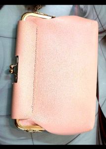Pink kiss-lock coin purse