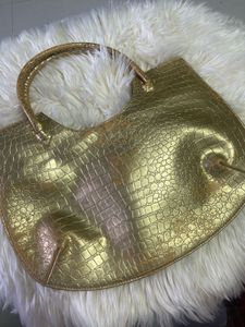 Luxury gold handbag made in Thailand