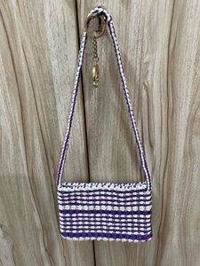 A Handmade Macrame Sling Bag.