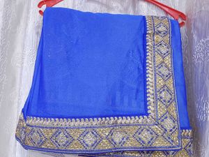 Half net saree with stiched blouse and peticoat