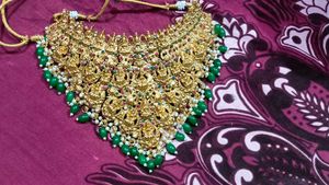 Ornate Gold Necklace with Green Beads