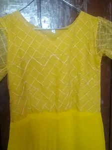 Beautiful Mustard Gown With Netted Layer