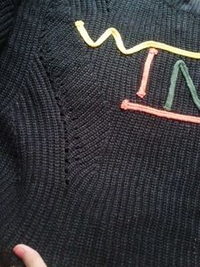 Black &#34;WIND&#34; Knit Sweater