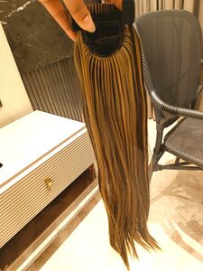 Pony Tail Hair Extensions In Blonde Highlights