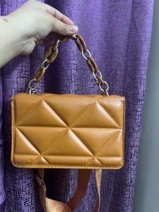 Quilted Orange Sling Bag With A Chain