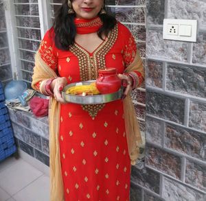 Red tamato color party wear kurta.