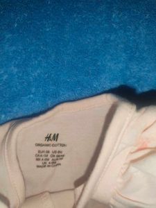 Flounce-trimmed romper Suit