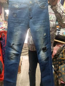 Distressed Blue Denim Jeans
