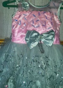 A Pink Frock With Cement Flowers